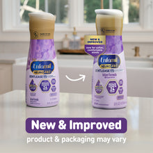 [32493348683838][32493348716606]Two bottles of Enfamil Neuro Pro formula on a kitchen counter with a 'New & Improved' label.
