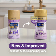 [32493348749374][32493348782142]Two bottles of Enfamil NeuroPro Gentlease infant formula on a kitchen counter with text indicating new and improved product.