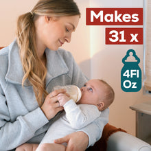 [49668588426]Woman holding a baby and feeding them from a bottle with text indicating bottle capacity.