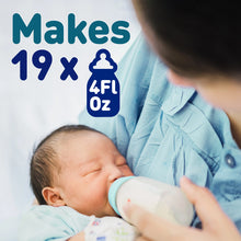 [42732446974133]Person holding a baby and a bottle with text indicating bottle capacity.