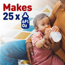 [49668504906]Person holding a baby and a bottle with text indicating product capacity.