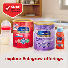 Enfagrow Toddler nutritional drinks with a bottle and packaging on a kitchen counter.