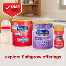 Enfagrow toddler nutritional drinks with a bottle and packaging on a kitchen counter.